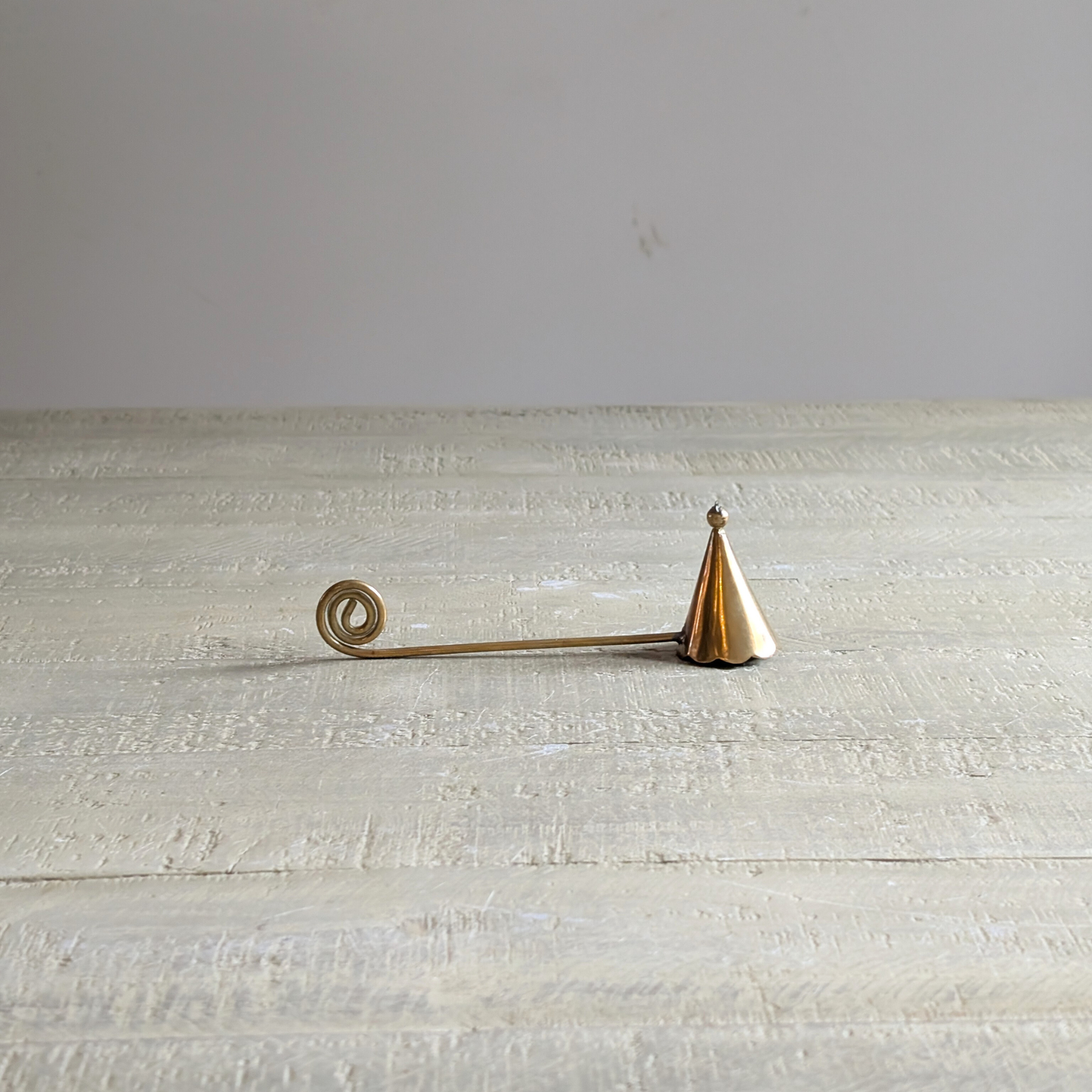 Curly Brass Candle Snuffer