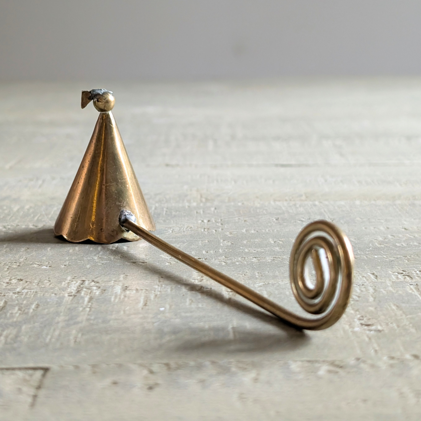 Curly Brass Candle Snuffer